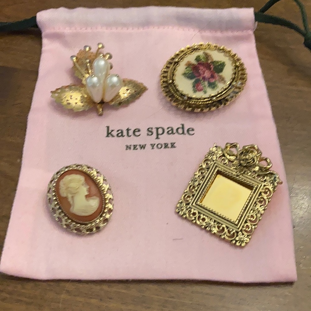 4 vintage pins and Kate spade dust bag